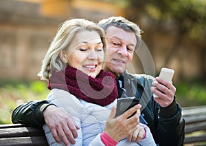Couple with mobile phones