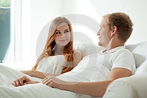 Couple during morning in bed