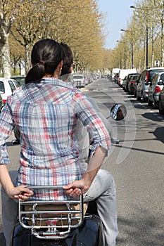 Couple on motorcycle without helmet