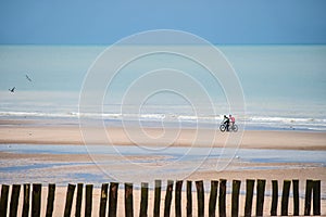 couple mountain biking on the beaches of Pas-de-Calais in France