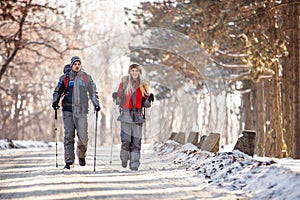 Couple of mountaineers hiking on winter