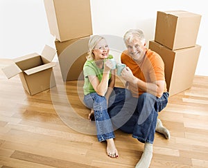 Couple with moving boxes.