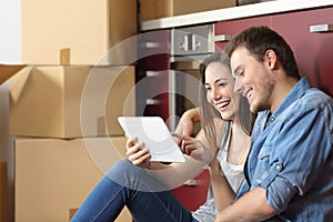 Couple moving home and buying online photo