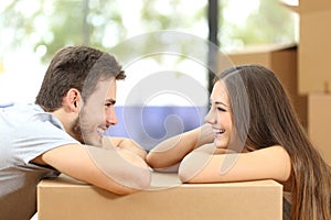 Couple moving house looking each other