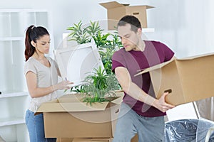 couple moving in house sitting on windowsill