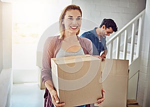 Couple, moving and new home with boxes, sunshine and happiness with mortgage, real estate and achievement. Apartment