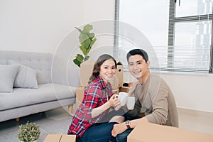 Couple moving new home. Happy married people buy new apartment