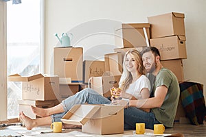 Couple moving new home. Happy people buy new apartment