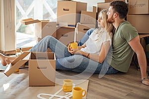 Couple moving new home. Happy people buy new apartment