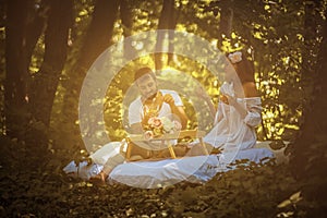 Couple in nature have breakfast together.