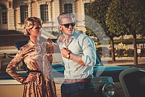 Couple near classic car