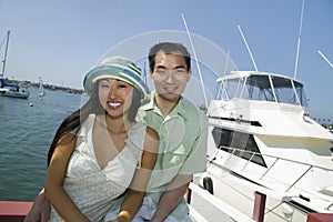 Couple near yacht in marina