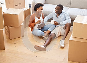 Couple, new home and boxes with pregnancy in happy for moving, house and relocating on floor in living room. African photo