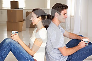 Couple in new home drinking tea