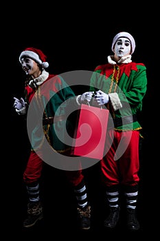 Couple of New Year elf mimes isolated