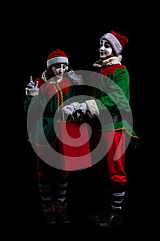 Couple of New Year elf mimes isolated