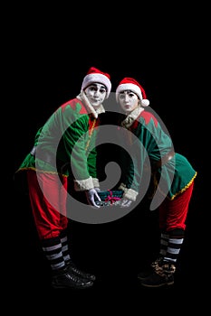 Couple of New Year elf mimes isolated