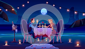 Couple at night beach have romantic date dinner