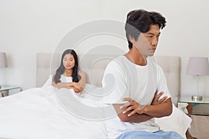 Couple not talking after argument in bed