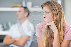 Couple not talking after a dispute on the couch