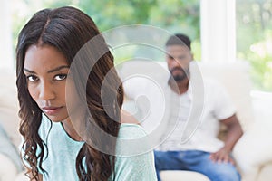 Couple not talking after a dispute on the sofa