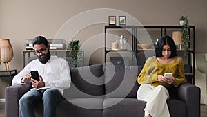 Couple Offended By Each Other Sitting With Phones On The Sofa