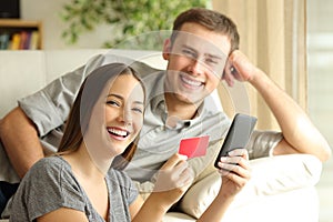 Couple of online buyers posing photo