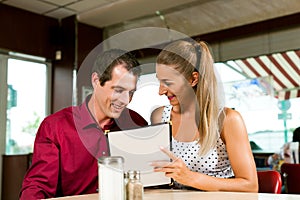 Couple order in a bar or restaurant