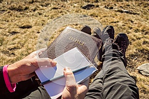 Couple at outdoor Bible study during mountain hike in the fall