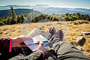 Couple at outdoor Bible study during mountain hike in the fall