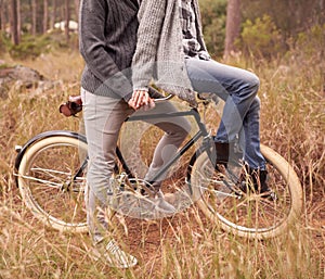 Couple, outdoor and bike with handlebars for carrying person for adventure, vacation or sustainability. People, retro