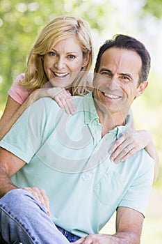 Couple outdoors smiling