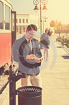 Couple outside retro train coach have a romantic encounter