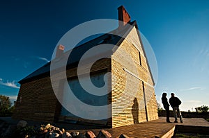 Couple outside timber home