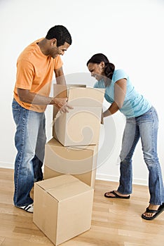 Couple packing boxes