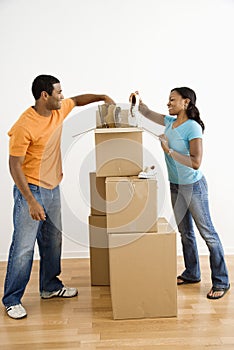 Couple packing boxes