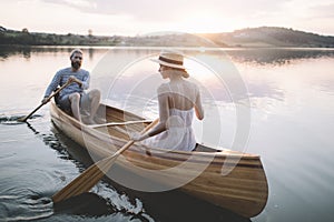 Couple paddling canoe