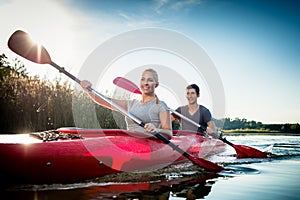 Couple paddling in kayak
