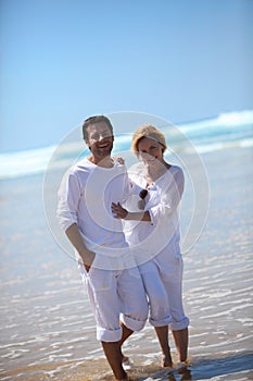 Couple paddling in the sea