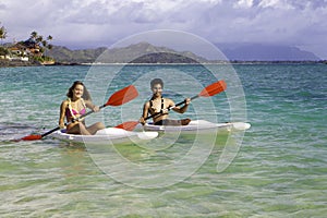 Couple paddling surfskis