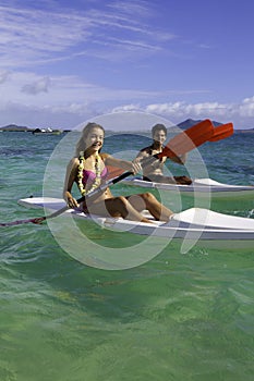 Couple paddling surfskis