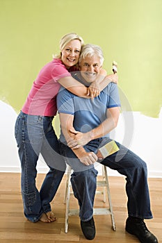 Couple with paintbrushes.