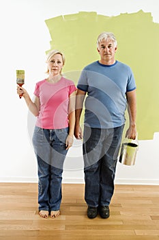 Couple with painting utensils.
