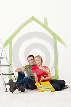 Couple with painting utensils resting