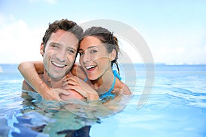 Couple palying in swimming pool