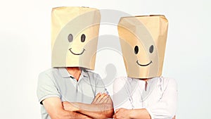 Couple with paper bags on the head