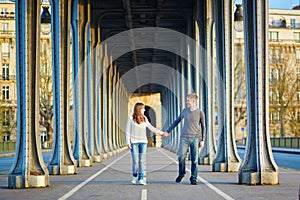 Couple in Paris on the Bir Hakeim bridge