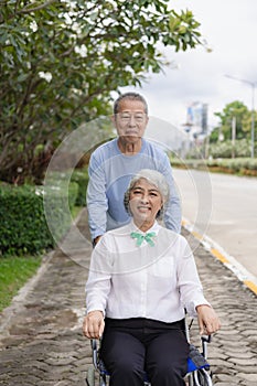 Couple in the park near home to relax, health and exercise in love sports, old man and senior woman taking a walk outdoors