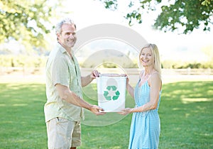 Couple, park and recycling bin for nature, environment and eco friendly growth for clean earth. People, portrait and