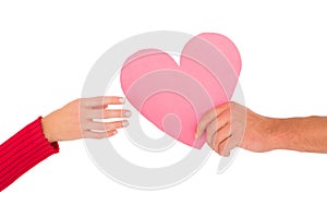 Couple passing a paper heart